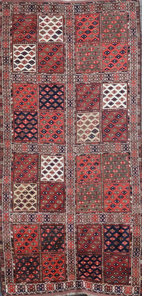 A Turkoman red ground rug, 6ft 2in by 3ft 7in.